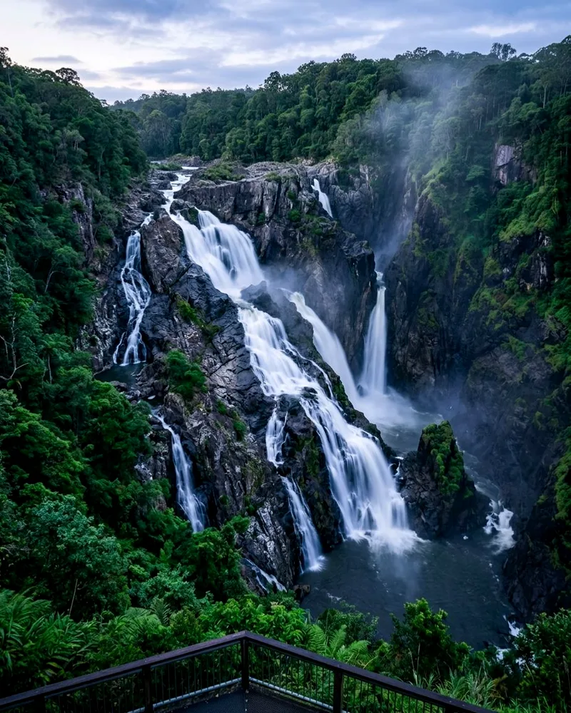 Barron Falls cascading down a misty rainforest gorge near Kuranda.